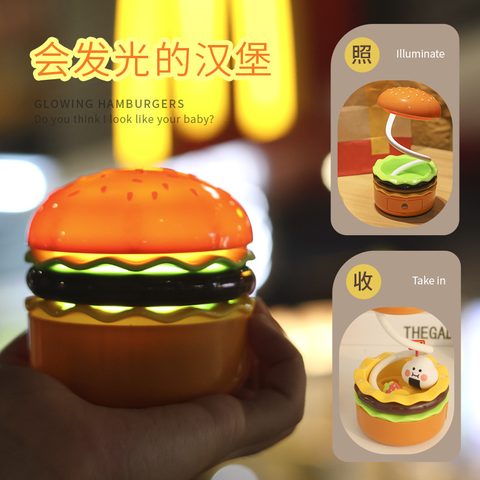 Burger-shaped LED night light glowing in a hand