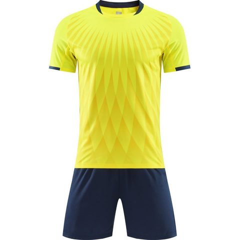 Yellow football shirt with navy shorts