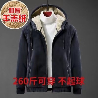 Navy fleece-lined hooded zip jacket over a white roll-neck